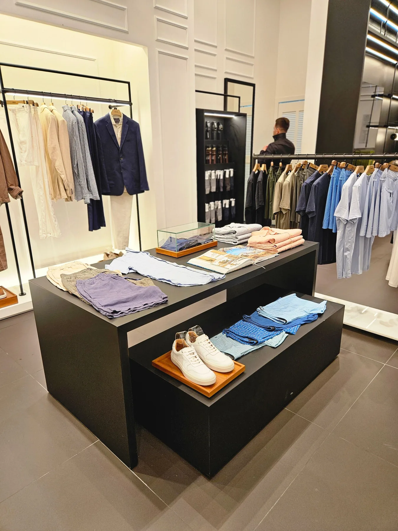 Premium fashion retail environment designed around commercial merchandising.