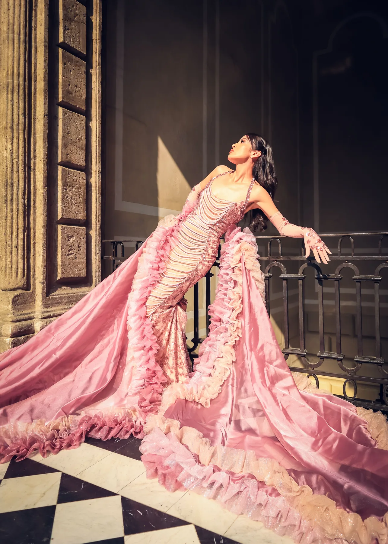 Editorial couture campaign image with a high-fashion presentation aesthetic.