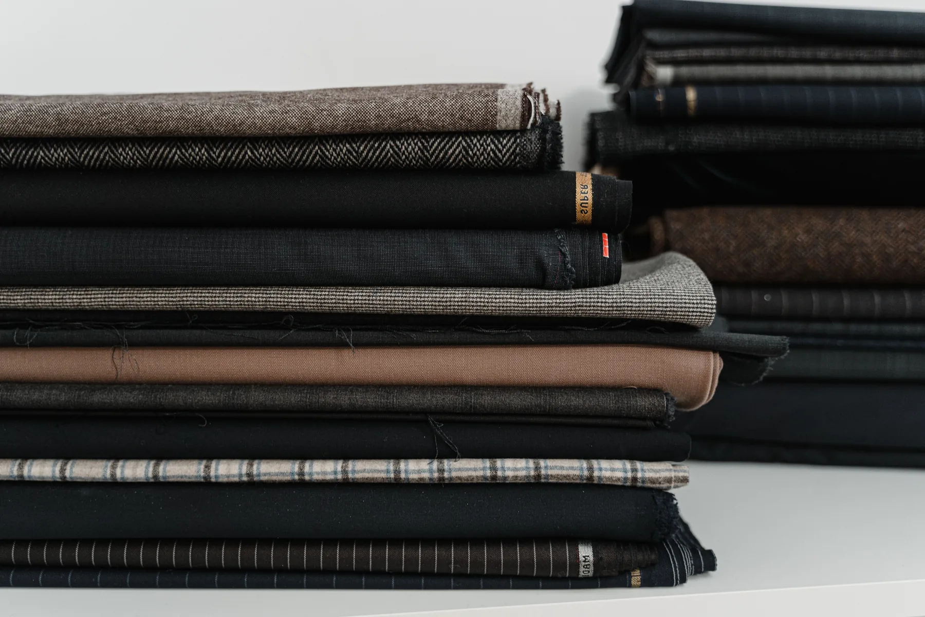 Premium textiles arranged as a commercial material and assortment study.